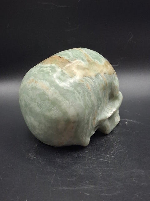 Green calcite skull! 1.4 pounds, 3.5 inches long, 2.7 inches tall