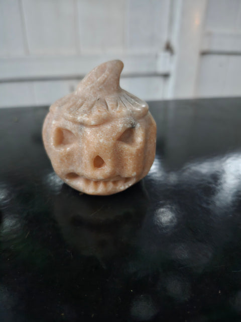 Orange calcite pumpkin. 9 ounces, 3 inches tall