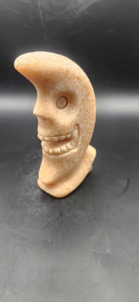 Orange calcite skull faced moon!! 7.2 ounces, 4 inches tall