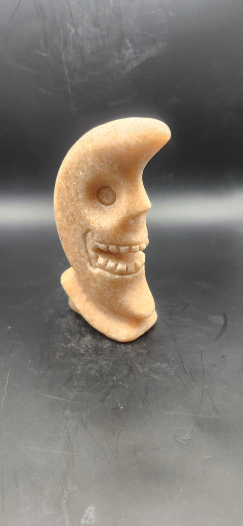 Orange calcite skull faced moon!! 7.2 ounces, 4 inches tall