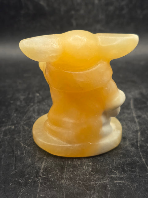 Orange calcite yoda! 4.4 ounces, 2.4 inches tall