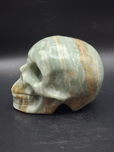 Green calcite skull! 1.4 pounds, 3.5 inches long, 2.7 inches tall